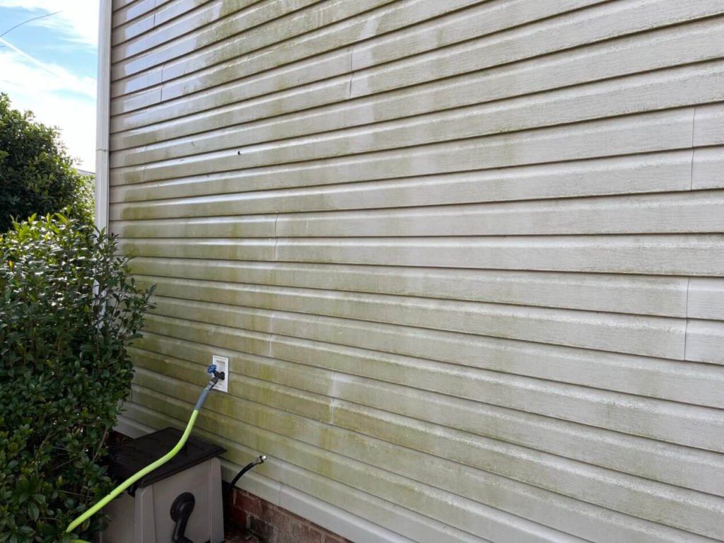 Dirty vinyl siding on a homes siding.