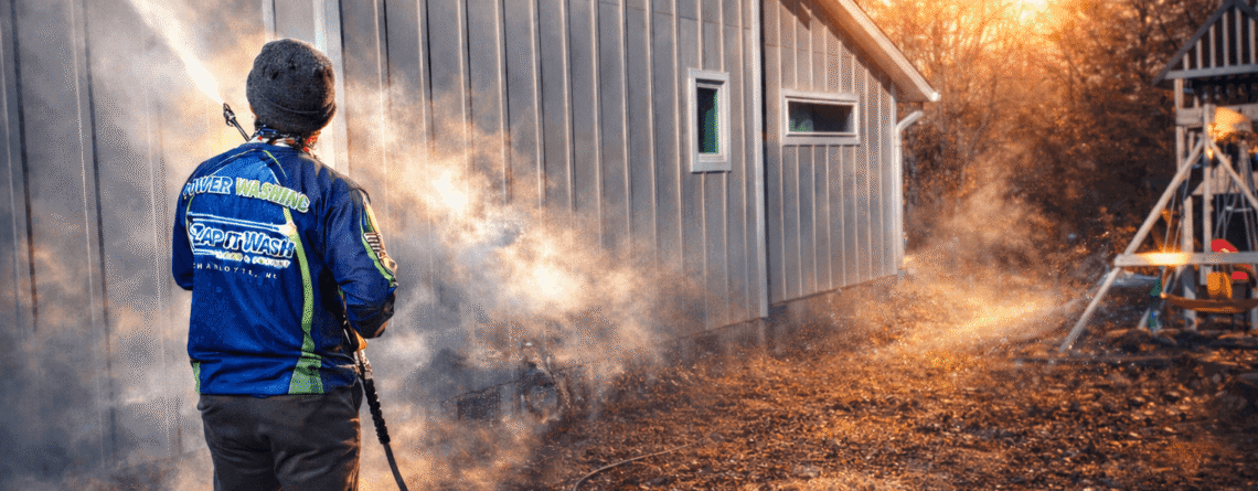 A residential home getting power washed in Charlotte.